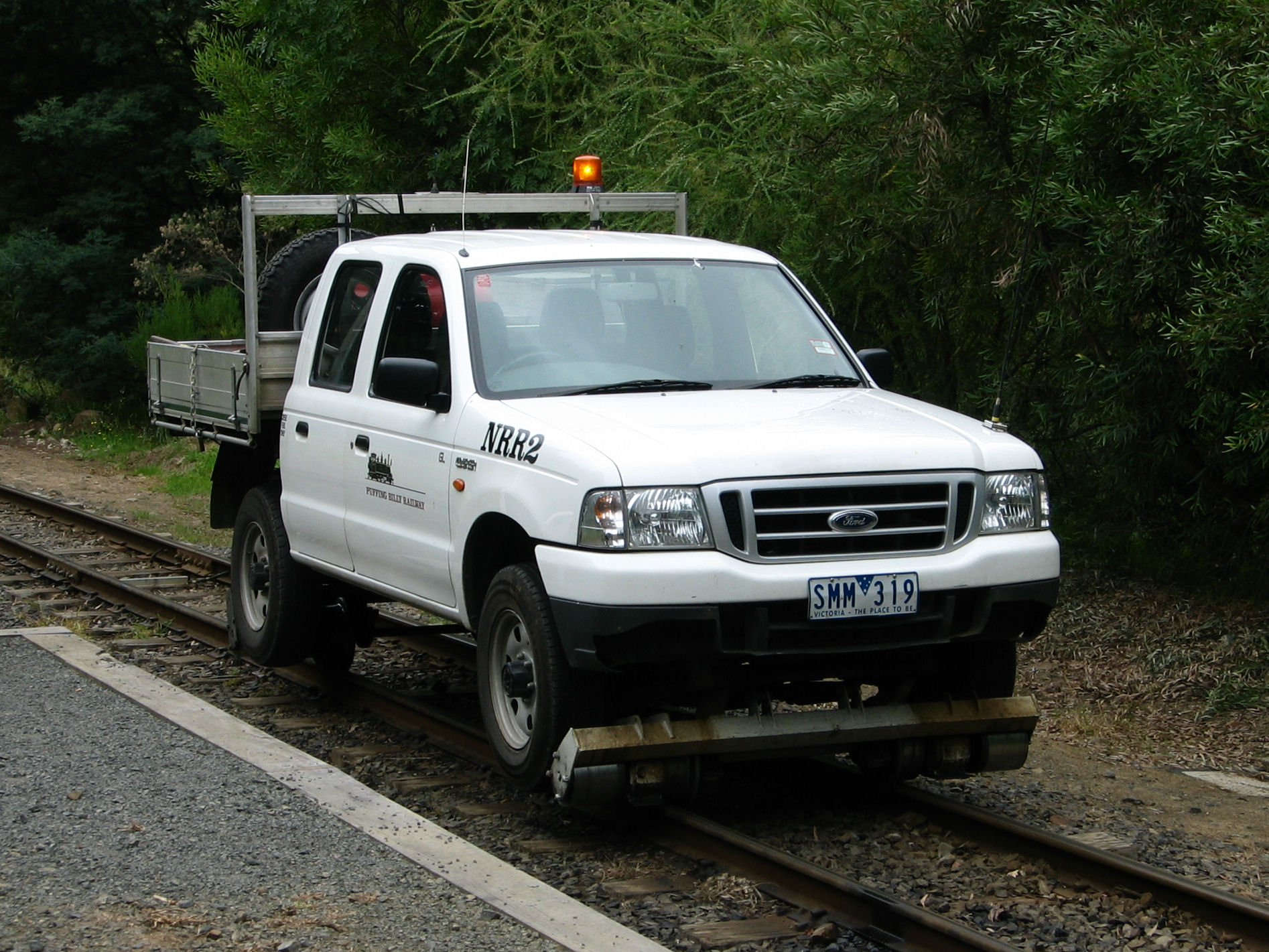 Open-sided Puffing Billy Railway carriage with passengers